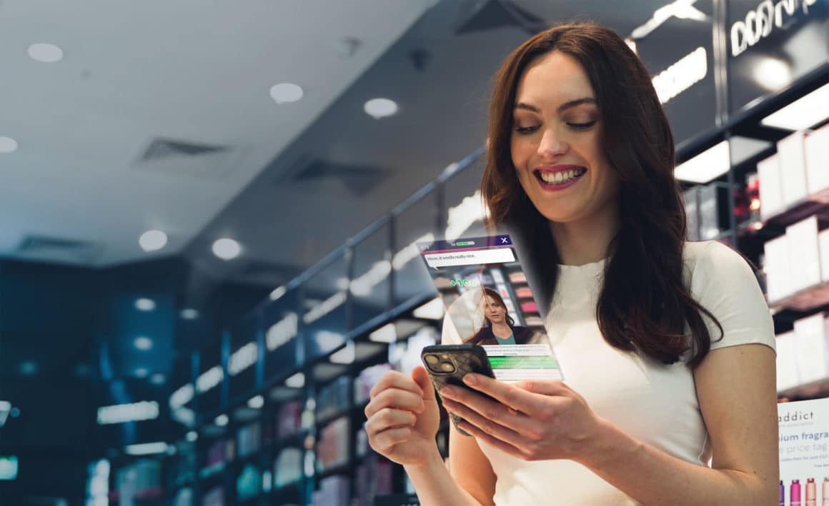 the fragrance shop employee playing attensi skills on her phone