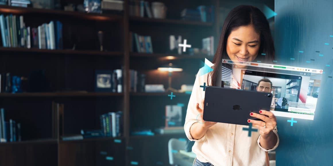 Woman holding an iPad playing an Attensi WORKFLOW solution