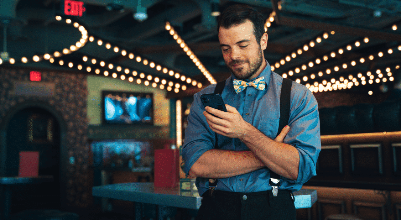 an employee in fight club is playing a training on his phone
